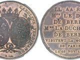 a close up of a coin with a crown on it