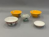 three bowls and two bowls are sitting on a table