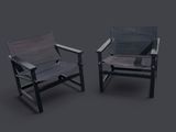 two black and grey chairs sitting next to each other on a gray surface