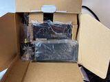 a cardboard box with a bunch of electronics inside of it