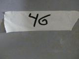 un bout de papier sur lequel est inscrit le chiffre 46