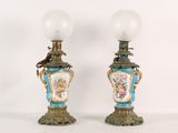 two lamps that are sitting next to each other on a table