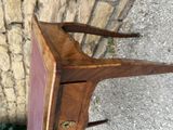 a wooden table with a drawer on top of it