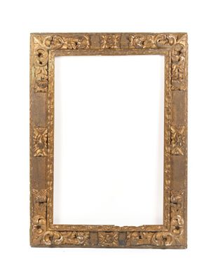 an old wooden picture frame with a decorative design on it
