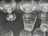 a lot of glasses that are sitting on a table