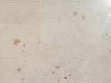 a lot of stains on the floor of this room