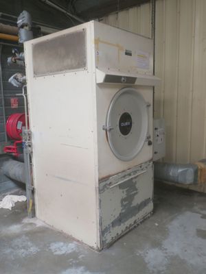 a white machine that is sitting in a garage