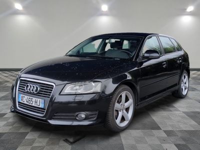 an image of a black audi wagon parked in a garage
