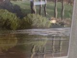 a picture of a giraffe that is standing in the water