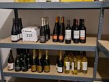 many bottles of wine on the shelves in the store