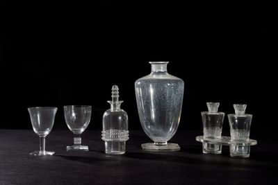 a lot of glass items that are on a table
