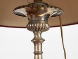 an image of a lamp with a red shade on it