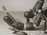 a black and white photo of a group of wooden toys