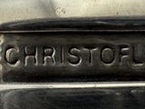a close up of a metal object with a name plate