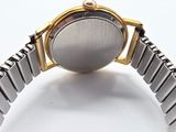 an image of a close up of a wrist watch on a white surface