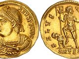 a gold coin with an image of a woman holding a sword