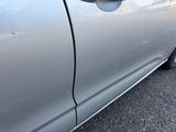 a close up of a car ' s door handle and door handle