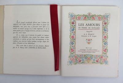 an open book with a red ribbon on top of it