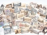 a lot of old postcards that are on the table