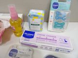 a lot of baby products on the counter in the bathroom