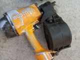 two power tools that are laying on the ground