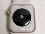 a close up of a white apple watch with a camera attached to it