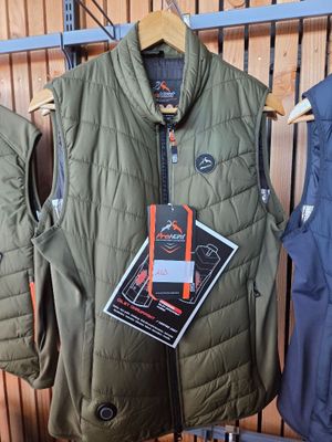 two vests hanging on a rack in a store