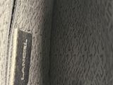 a close up of the inside of a purse with a tag on it