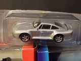 a toy car that is sitting on top of a stack of books