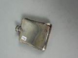 a small metal object with a tag on it