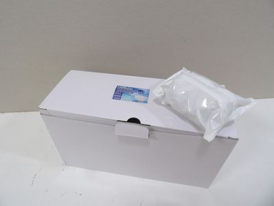 a white box with a tissue on top of it