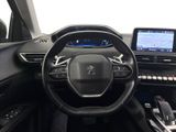 the interior of a car with a steering wheel, dashboard, and electronic controls