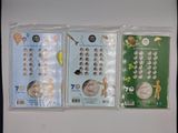 four different types of coins in plastic bags on a white surface