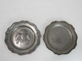 pair of silverplated dishes with a lion emblem on each side