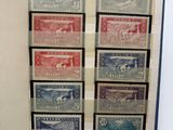 an open book with a bunch of stamps on it