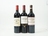 trois bouteilles de vin posées l'une à côté de l'autre sur une table