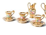 five cups and a saucer on a saucer and saucer