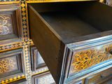 a wooden dresser with a drawer on top of it