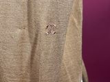 a close up of a man ' s jacket with two initials on it
