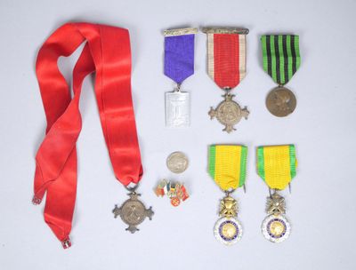many medals and medals laid out on the table