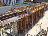 a construction site with scaffolding and scaffolding on the ground