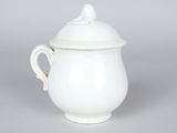 white porcelain teapot with lid and handle on grey background