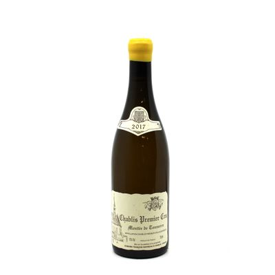 the bottle of wine is sitting on a white surface