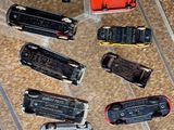 a lot of different toy trains on display in a case