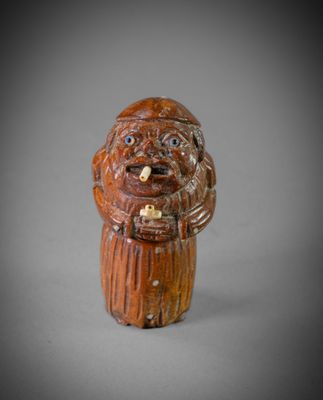 une image représentant une figurine d'un homme barbu