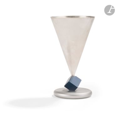 an image of a silver cup with a blue block in it