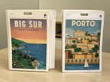 two boxes that have a picture of a city on them