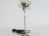 a lamp that has a flower on top of it