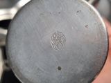 a person holding a metal object in their hand