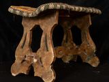a small wooden table with two legs and a wooden top